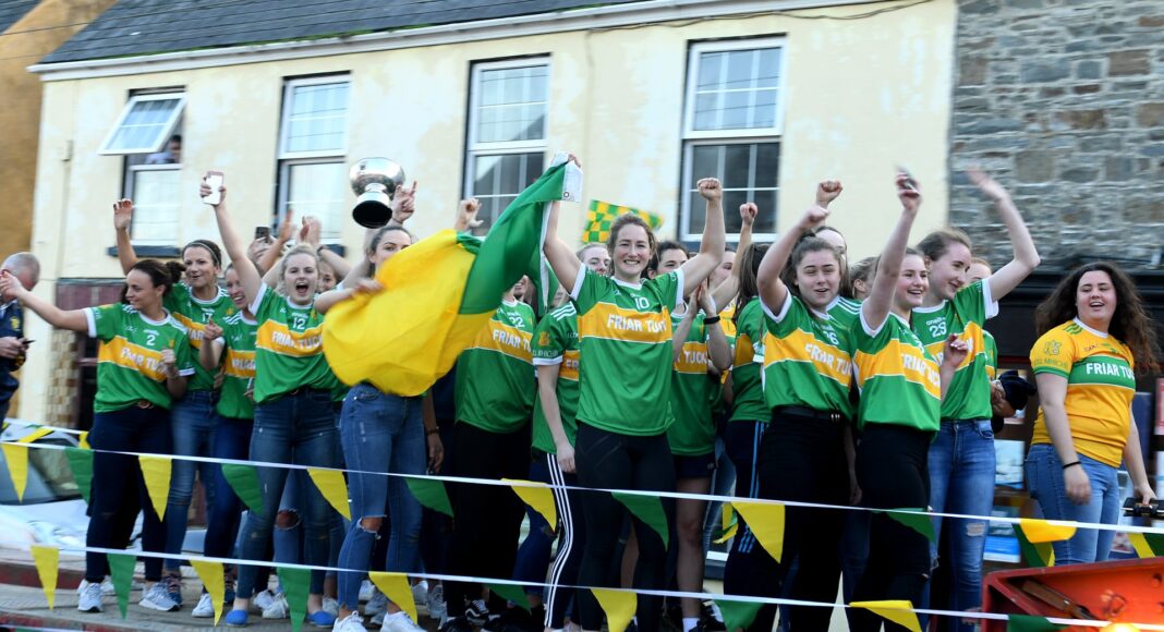 Ailish Considine leads the celebrations after Kilmihil's Clare LGFA title win. Pic (c) Kilmihil LGFA