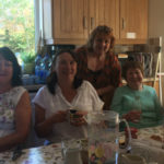 ladies-having-tea-around-table-696x385